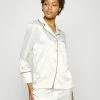Soldes En Ligne DORINA REGARDLESS - Haut de pyjama pyjamas et nuisettes col revers female -DORINA Soldes Boutique f3e1d48ec0e646079a26f1b5a7c0eca7